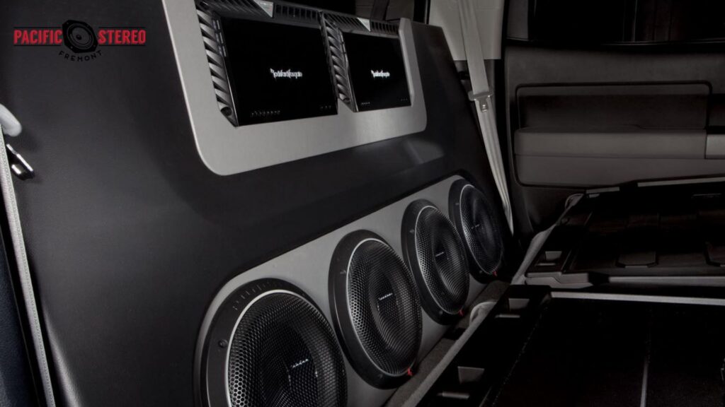 Custom vehicle interior featuring multiple speakers and amplifiers from a Best Car Audio setup